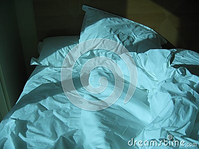 Rumpled bed Stock Photo