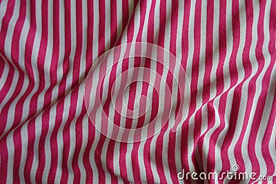 Rumpled striped fabric in pink and white Stock Photo