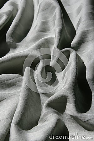 Rumpled striped sheet Stock Photo