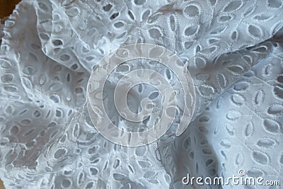 Rumpled white eyelet embroidery cotton fabric Stock Photo