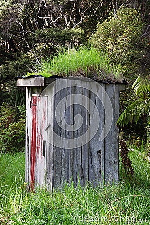 Run down outhouse Stock Photo