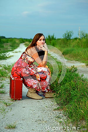 Runaway girl on suitcase Stock Photo