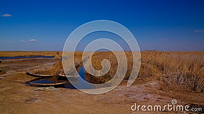 Runed Urga fishing village at the shore of Sudochye lake aka part of former Aral sea, Karakalpakstan, Uzbekistan Stock Photo