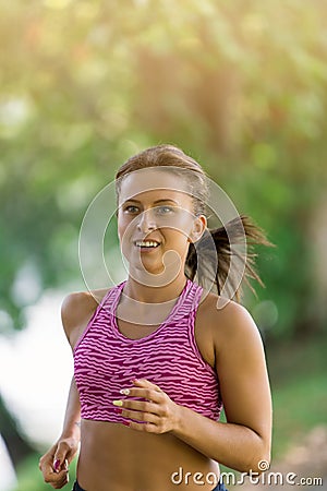 Runner athlete running at park. woman fitness jogging workout wellness concept. Stock Photo