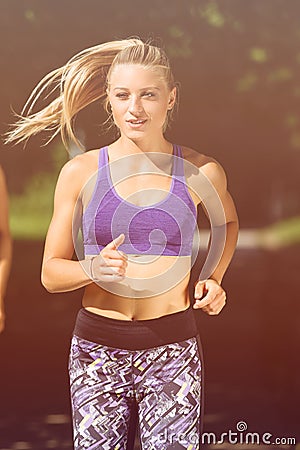 Runner athlete running at park. woman fitness jogging workout wellness concept. Stock Photo