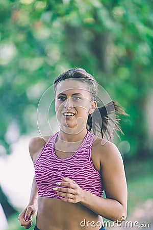 Runner athlete running at park. woman fitness jogging workout wellness concept. Stock Photo