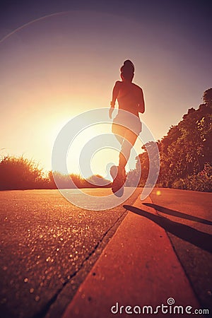 Runner athlete running at seaside road Stock Photo