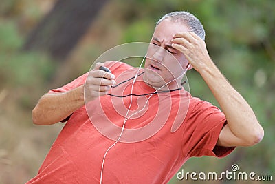 Runner checking heart rate pulse during workout Stock Photo