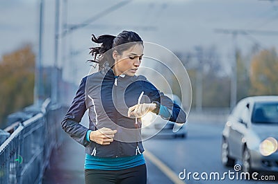 Runner checking time Stock Photo