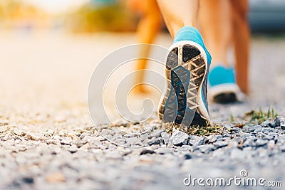 Sport. Runner feet running on road close up on shoe. Stock Photo