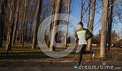 Runner joggin in the park in the winter Stock Photo