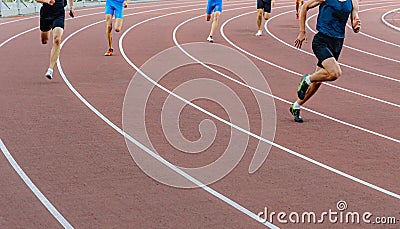 runner leader run ahead of sprint race on turn stadium track Stock Photo