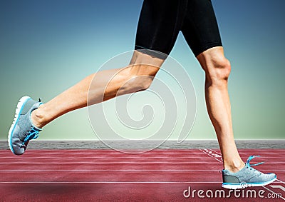 Runner legs on track against blue green background Stock Photo