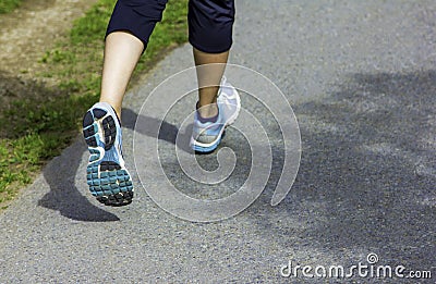 Runner - running shoes closeup on runners shoes feet running on road fitness jog workout healthy lifestyle fitness jogging Stock Photo