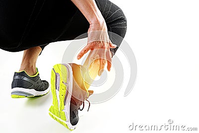 Runner sportsman holding ankle in pain with Broken twisted joint Stock Photo