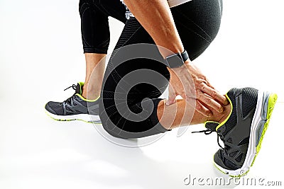 Runner sportsman holding ankle in pain with Broken twisted joint Stock Photo