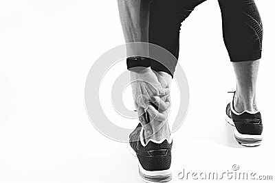 Runner sportsman holding ankle in pain with Broken twisted joint Stock Photo