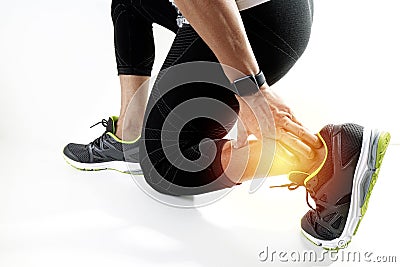 Runner sportsman holding ankle in pain with Broken twisted joint Stock Photo