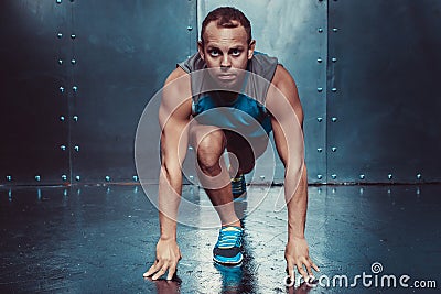 Runner, sportsman muscular man in a position of readiness, sport, run Stock Photo