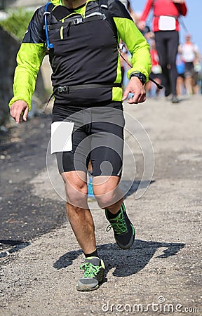 Runner with sportswear running fast during the race Stock Photo