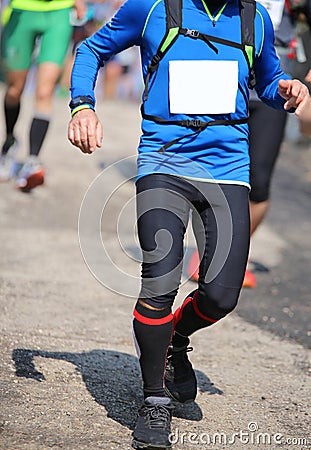 Runner with sportswear running fast during the race Stock Photo