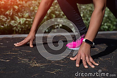 Runner start position. Closeup of female runner`s hands on start position Stock Photo