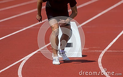 Runner in start position prepares for the start. Individual sport conept Stock Photo