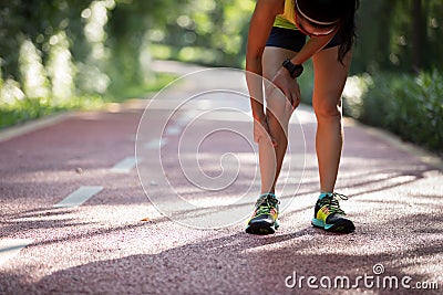 runner suffering with pain on sports running knee injury Stock Photo