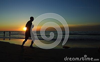 Runner at sunset, La Jolla Shore Stock Photo