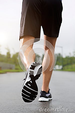 Runner wearing sneakers and shorts Stock Photo