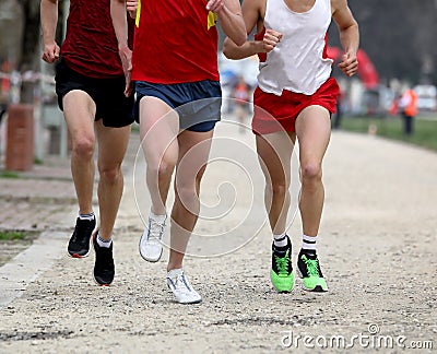 runners at finish line after the footrace Stock Photo