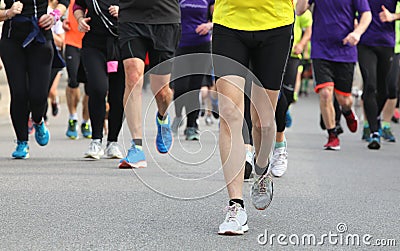 runners at footrace on the road of the city Stock Photo