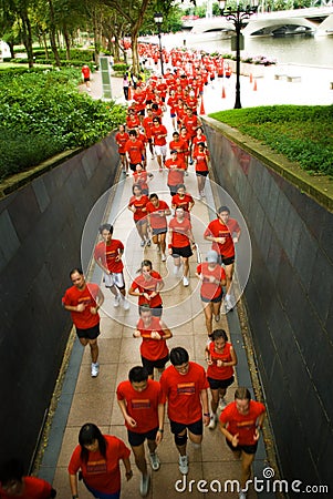 Runners racing in red tops Editorial Stock Photo