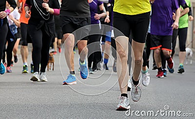 runners run at footrace in the city Stock Photo