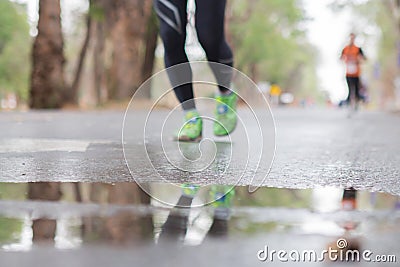 Runners running in city marathon, motion blur on sporty legs Stock Photo