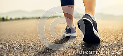 Runners` shoes are prepared to leave the starting point. Jogging workout and sport healthy lifestyle. Stock Photo