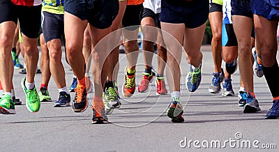 Runners to race to the finish line of the marathon Stock Photo