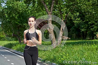 Running asian woman on running track. Morning jogging. The athlete training Stock Photo