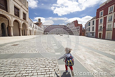 Running child at Upper Square of Badajoz, Extremadura, Spain Stock Photo