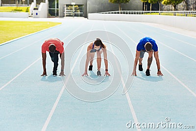 Running, fitness and people on track for race, challenge and competition for field event in stadium. Sports, health and Stock Photo