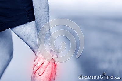 Running injury, knee pain Stock Photo