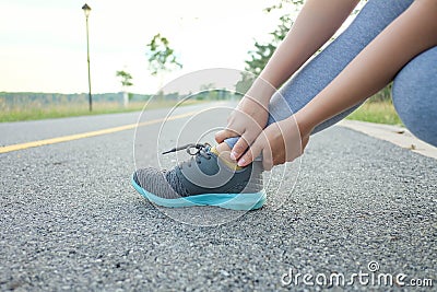 Running injury leg accident- sport woman runner hurting holding painful sprained ankle in pain Stock Photo