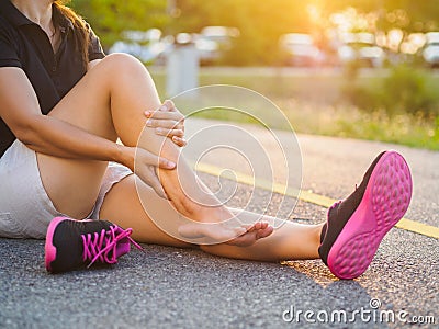 Running injury leg accident- sport woman runner hurting holding Stock Photo