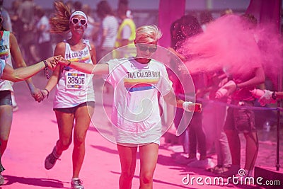 Running people at a color run in Cologne Editorial Stock Photo
