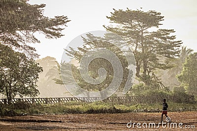 Running in the rain Editorial Stock Photo