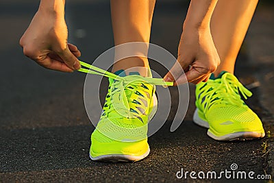 Running shoes. Barefoot running shoes closeup. Female athlete ty Stock Photo