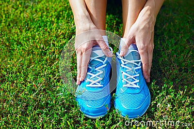 Running shoes on grass - concept. Stock Photo