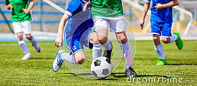 Running Soccer Football Players. Footballers Kicking Football Match Stock Photo