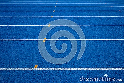 Running track with number. Blue running track in stadium. Stock Photo