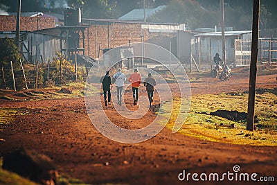 Running training in Kenya. A group of Kenyan runners prepare for a marathon and run on red soil. Marathon running, Track and Field Editorial Stock Photo